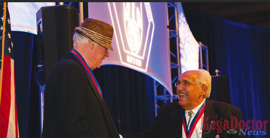 At left: Dr. Jay Scully, immediate past president of the American College of Psychiatrists and former CEO and medical director of the American Psychiatric Association, shakes hands with Dr. Francisco Fernandez, current president of the ACP and founding dean of the UTRGV School of Medicine. The medal Fernandez is wearing is the Bowis Award, presented each year by The College to a member who has played an important leadership role in the organization. The award consists of a gold medallion and a certificate, and the recipient receives travel, hotel and free registration at the annual meeting. Photo by Kevin Shick  