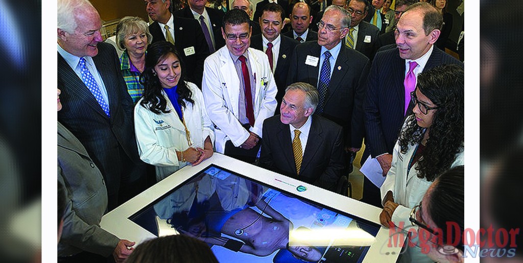 Dr. Leonel Vela (in white coat), founding dean of the RAHC and now UTRGV senior associate dean of education, showcases some of advanced medical technologies at the RAHC’s Smart Hospital in Harlingen during a tour Monday, Sept. 14, 2015. Looking on are U.S. Sen. John Cornyn (far left), Gov. Greg Abbott (center), U.S. Rep. Henry Cuellar (behind Vela), U.S. Rep. Rubén Hinojosa (behind Abbott), and U.S. Department of Veterans Affairs Secretary Robert McDonald (far right). UTRGV Photo by David Pike.