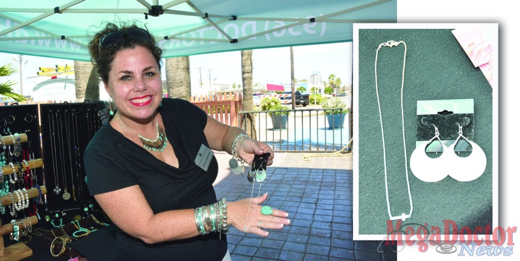 Brittany Gabrielson showing her most popular jewelry pieces by Silpada Designs. The Half Moon Bay earrings sterling silver and the cross necklace