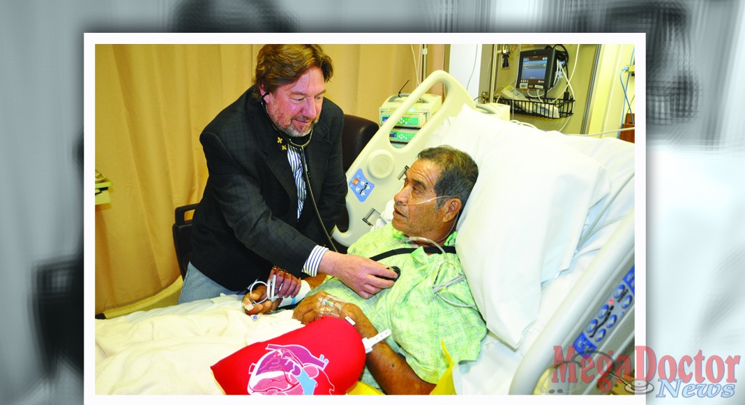 Dr. Mark Morales, a new Cardiovascular Surgeon who is now performing minimally-invasive heart surgeries in Harlingen and Brownsville, checks on patient Jacobo Salinas at Valley Baptist Medical Center in Harlingen.