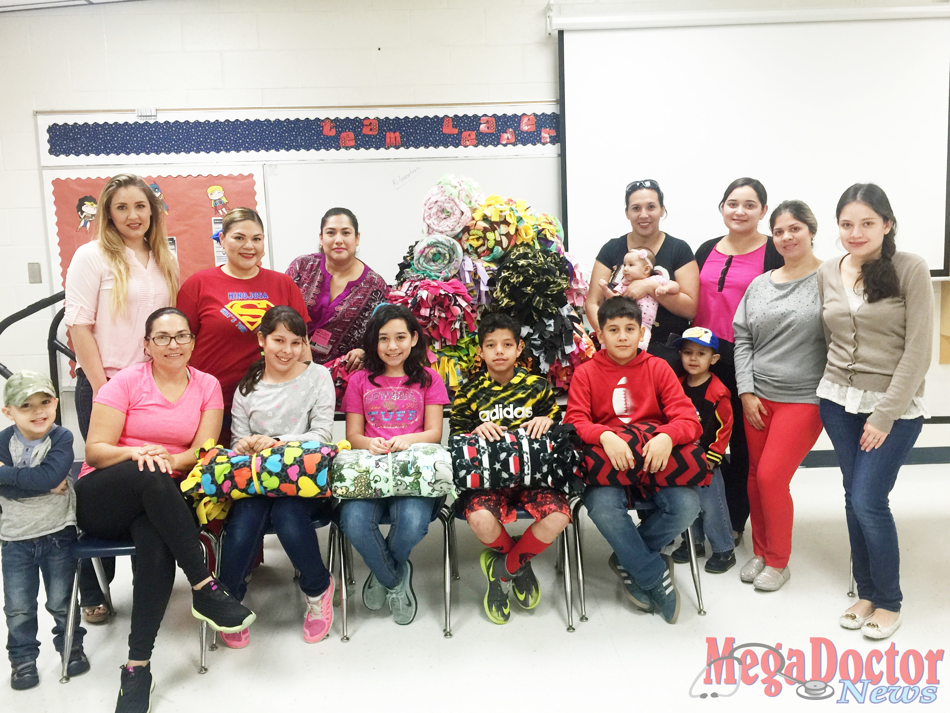 Students and parents from Ruben Hinojosa Elementary School in Sharyland ISD make knotted fleece blankets for pediatric patients at The Children’s Hospital at Renaissance.