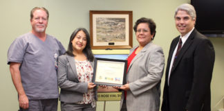 Florestela Delgado of the San Antonio Eye Bank, second from left, presents an award to Knapp Medical Center for helping in efforts to heal the blind through a cornea donation program. Accepting the award are Tony Ashley, RN, Knapp Medical Intensive Care Unit Director; Anna Hinojosa, Chief Nursing Officer for Knapp Medical Center; and Knapp CEO Rene Lopez.