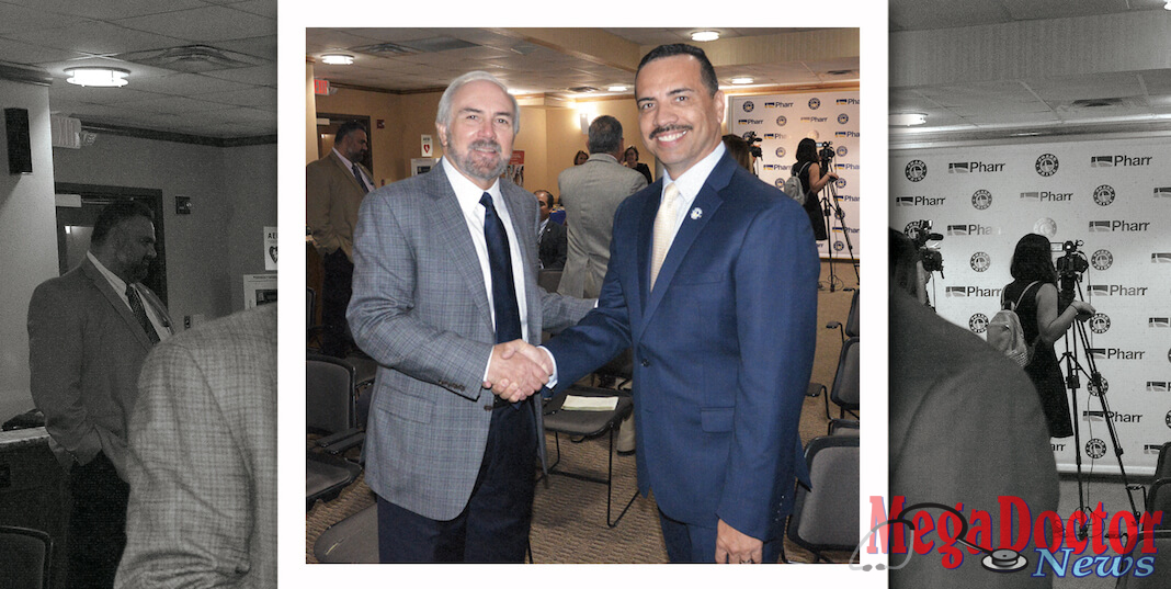Dr. Guy Bailey, President of the University of Texas RGV, shakes hands with Dr. Ambrosio Hernandez, mayor of the City of Pharr. Mayor Hernandez had just delivered $500,000 commitment to help the medical school. Photo by Roberto Hugo Gonzalez