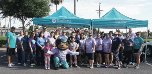 Employees and staff at Doctors Hospital at Renaissance celebrate National Cancer Survivors Day® in 2016 at a special Walk With A Doc event.