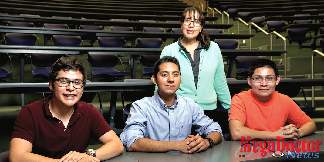 A team of four UTRGV mechanical engineering students have designed a prototype device that will help Parkinson’s disease victims right legibly again. The development of their Self-Stabilization Holder, a yearlong endeavor which became their senior design project, was overseen by Dr. Karen Lozano, professor of mechanical engineering (standing). This spring the device placed second in the Rafael Munguia UTRGV Business Plan Competition overseen by the Robert C. Vackar College of Business & Entrepreneurship. The students (left to right) are Carlos Hernandez, Misael Martinez, and Rodolfo Becerra. Team member Arnoldo Ventura, currently participating in an out-of-state internship, is not pictured. (UTRGV Photo by Paul Chouy)