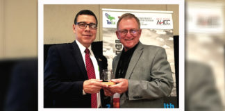 Dr. Leonel Vela (at left), UTRGV senior associate dean for Education and Academic Affairs and chair of the Department of Medical Education, has been recognized by the Texas Tech University Health Sciences Center F. Marie Hall Institute of Rural and Community Health – which he established during his time at Texas Tech – for his role in expanding access for the under-served in the state. He is shown here with his 2017 Rural Health Visionary Award with Dr. Billy Phillips, executive vice president of the institute. (Courtesy Photo)