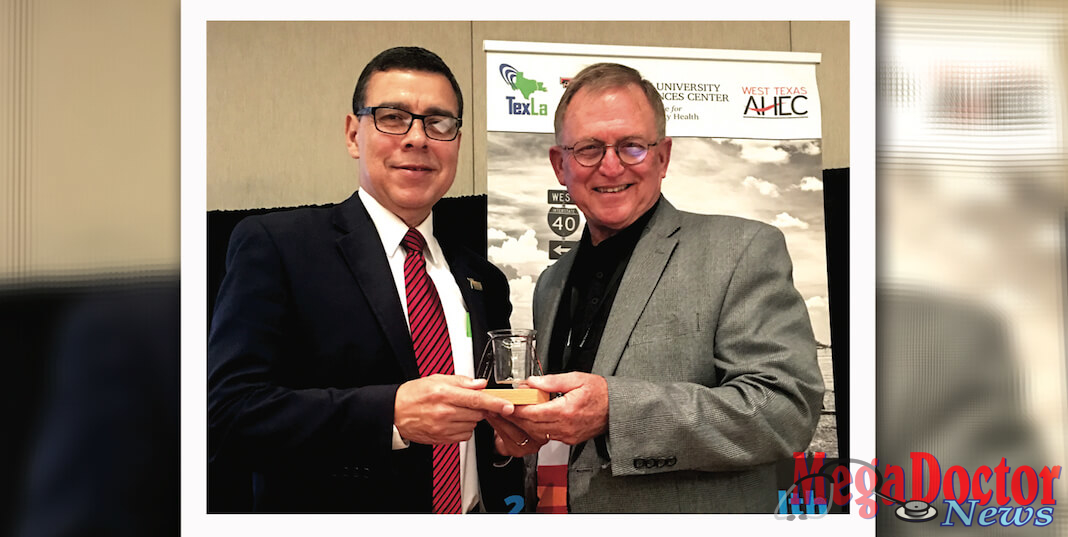 Dr. Leonel Vela (at left), UTRGV senior associate dean for Education and Academic Affairs and chair of the Department of Medical Education, has been recognized by the Texas Tech University Health Sciences Center F. Marie Hall Institute of Rural and Community Health – which he established during his time at Texas Tech – for his role in expanding access for the under-served in the state. He is shown here with his 2017 Rural Health Visionary Award with Dr. Billy Phillips, executive vice president of the institute. (Courtesy Photo)