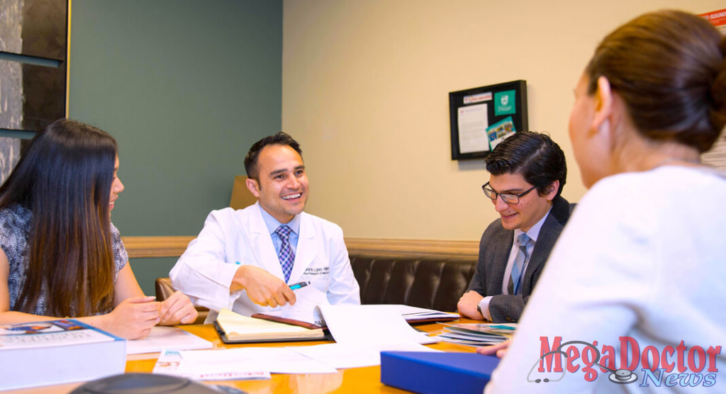 Pictured Above: Dr. Michael Martinez, Bariatric Surgeon at the DHR Health Bariatric and Metabolic Institute, speaks with a patient. Dr. Martinez received the Young Physician of the Year Award from the National Hispanic Medical Association.