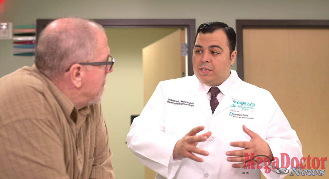 Pictured Above: Dr. Michael Martinez, Bariatric Surgeon at the DHR Health Bariatric and Metabolic Institute, speaks with a patient. Dr. Martinez received the Young Physician of the Year Award from the National Hispanic Medical Association.