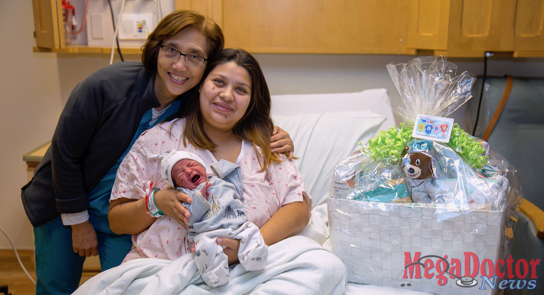 Dinora Sanchez, who delivered DHR Health Women’s Hospital first baby of 2019, receives a gift basket from the nursing staff at DHR Health Women’s Hospital.