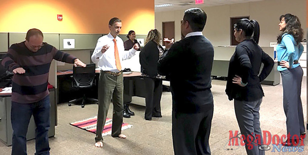 Each workday, at 9 a.m., 11 a.m., and 4 p.m., employees step away from their desks to participate in short exercise sessions led by Elma Vega, an administrative assistant in the UTRGV Department of Population Health and Biostatistics.