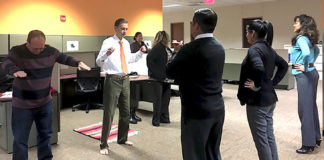 Each workday, at 9 a.m., 11 a.m., and 4 p.m., employees step away from their desks to participate in short exercise sessions led by Elma Vega, an administrative assistant in the UTRGV Department of Population Health and Biostatistics.