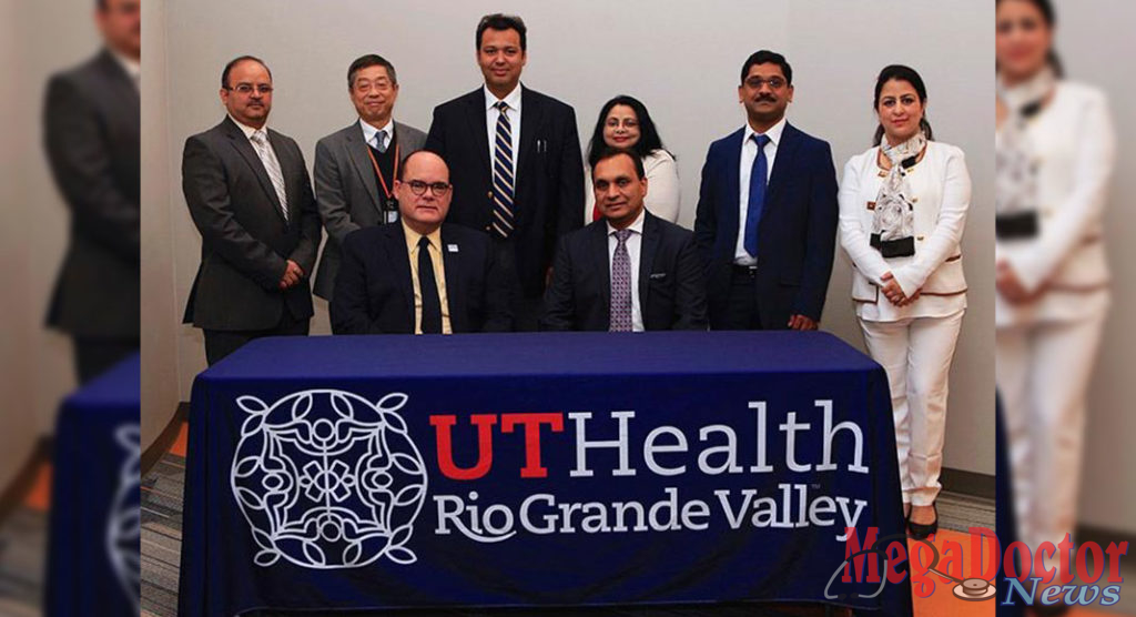 Dr. John H. Krouse (seated, at left), UTRGV executive vice president for Health Affairs and dean of the UTRGV School of Medicine, recently welcomed Dr. Subhash C. Chauhan, Ph.D. (seated, at right), as founding director of the South Texas Center of Excellence in Cancer Research and chair of the Department of Immunology and Microbiology at the UTRGV School of Medicine. Also present at the welcoming ceremony were Dr. Andrew Tsin (standing, second from left), UTRGV associate dean of Research; and Chauhan team members (from left) Dr. Manish Tripathi (far left), Dr. Bilal Hafeez (third from left), Dr. Meena Jaggi, Dr. Murali Yallapu and Dr. Sheema Khan. (Courtesy Photo)