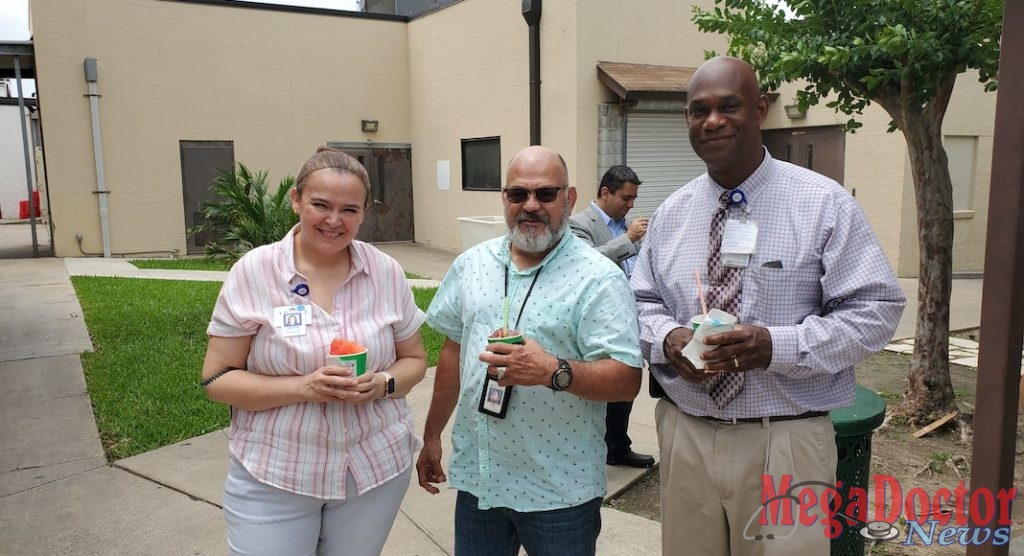 Photo caption: (Left to right) Adriana Cotal, Food Services Manager; Roy Rios, Certified Coding Specialist, Health Information Management; and Len Al Blakely, Food Services Director enjoy some snow cones and fellowship during Valley Baptist-Brownsville’s Hospital Week activities on Friday, May 17.