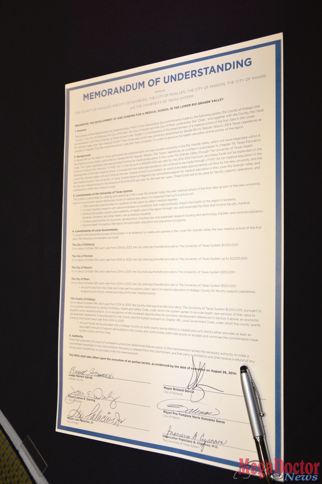 This is the Memorandum of Understanding executed by six leaders committing to fund the school of medicine. Photo by Roberto Hugo Gonzalez August 2014