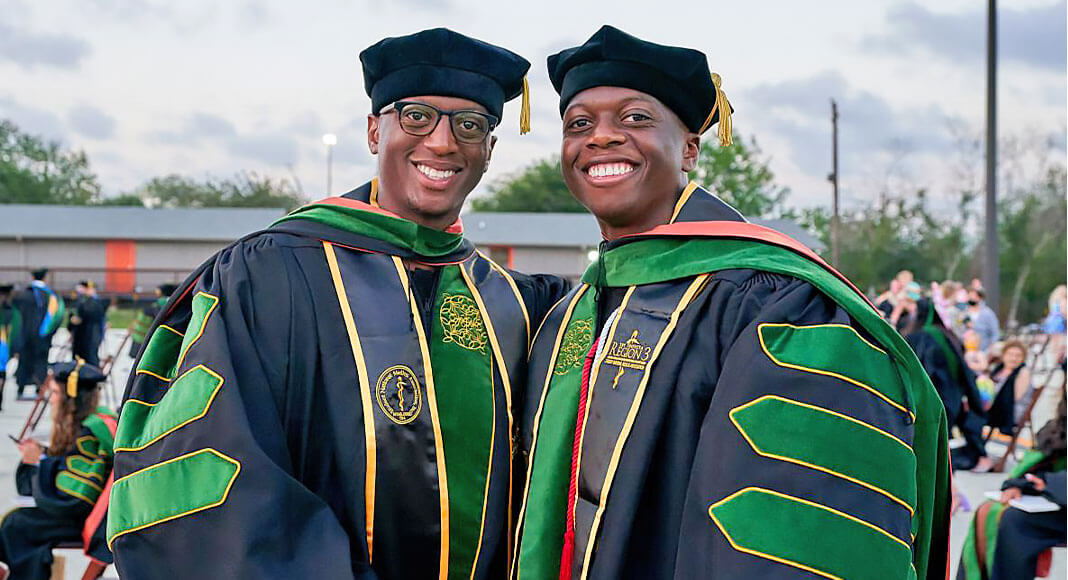 McAllen natives and brothers Macaulay Ojeaga and Patrick Ojeaga posed together May 8, 2021, on the UTRGV Brownsville Campus, during their graduation from the UTRGV School of Medicine. Patrick is now a resident physician at the University of Texas Southwestern Medical School, and Macaulay is now at the University of Kansas School of Medicine. (UTRGV Photo by David Pike)