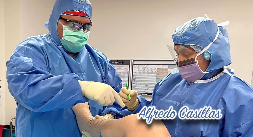 Texas State Technical College alumnus Alfredo Casillas (left) prepares a patient for surgery. (TSTC photo)
