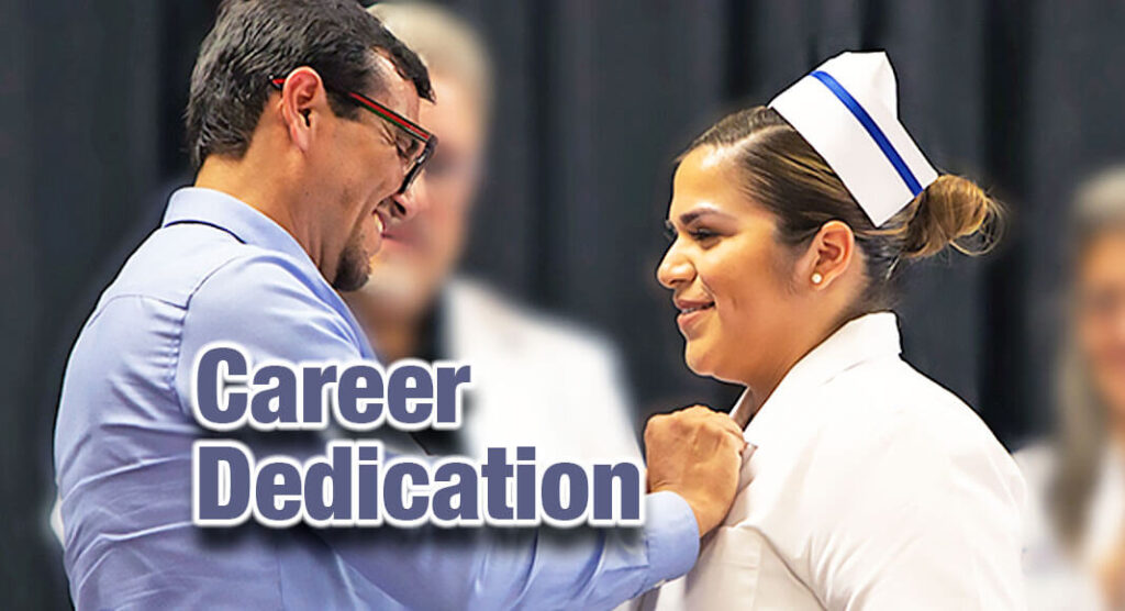 TSTC Vocational Nursing graduate Aaron Sotelo has a pin placed on her TSTC Nursing uniform by her father, Victor Sotelo, that signifies her as a newly graduated vocational nurse at the recent TSTC Vocational Nursing pinning ceremony. (Photo courtesy of TSTC.)